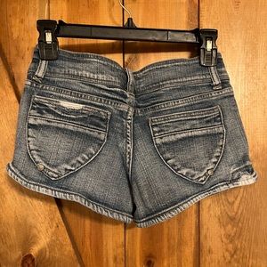 Distressed denim shorts
